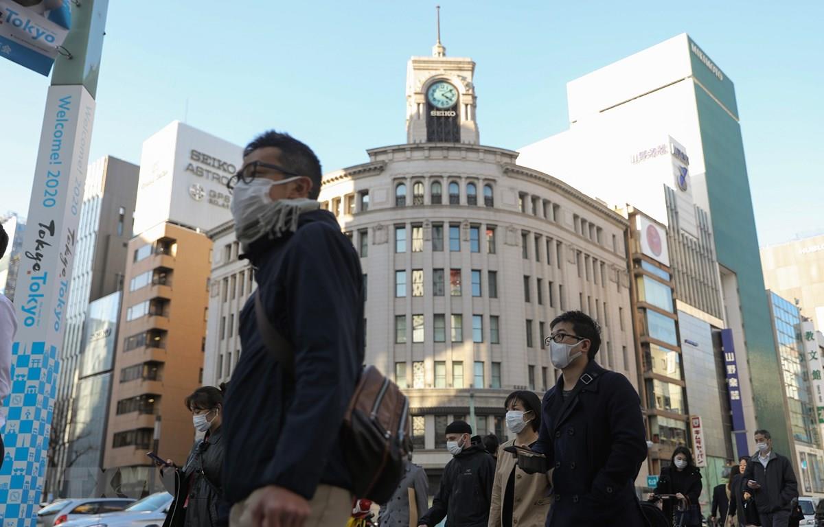 COVID-19: Nhật Bản lần đầu nâng mức độ cảnh báo với toàn thế giới